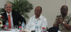 Home Affairs Minister, Clement Rohee [center) flanked by Police Commissioner, Leroy Brumell (right) and Director of TEG, Dennis Hays. [iNews' Photo]