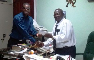 – General Secretary of the Alliance for Change [AFC), David Patterson submits the motion to Clerk of the National Assembly, Sherlock Isaacs 