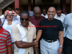 Publisher of the Kaieteur News, Glenn Lall greets supporters outside the Georgetown Magistrate's Court shortly after being charged. 