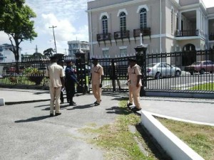 Security officials locked the gate of the Parliament building in light of the protest outside. [iNews' Photo]