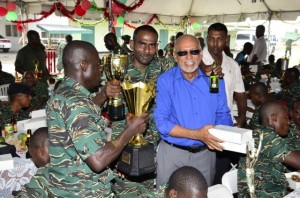 President Donald Ramotar sharing a light moment with ranks of the Guyana Defence Force at Camp Stephenson, Timehri