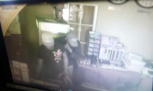 The two gunmen caught on camera executing the robbery