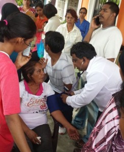 The dead man's wife, Jameela Hamid being attended to by a doctor. [iNews' Photo]