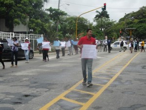 The PPP/C conducts a peaceful protest outside GECOM's office. [iNews' Photo]