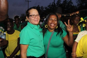 Mrs Granger with an APNU+AFC supporter during the campaign trail