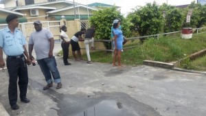 Some relatives of the dead teen outside the Diamond Hospital. [iNews' Photo]