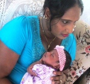 Omawattie Samaroo and her baby girl following her delivery.