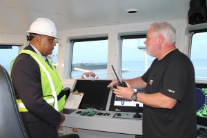 Minister of Governance Mr. Raphael Trotman pays keen attention as the Captain of the Fugro Americas explains the vessel’s capabilities.