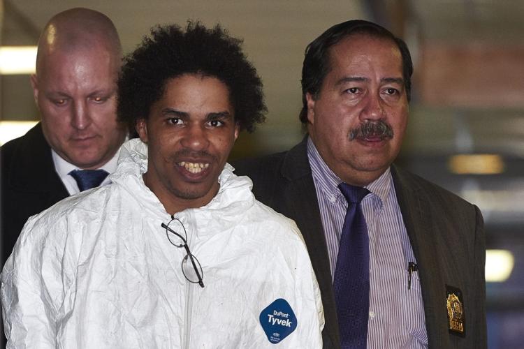 Jerry Pagan, 32, is escorted by New York Police Department detectives from the 44th Precinct on Sunday. [JAMES KEIVOM/NEW YORK DAILY NEWS)