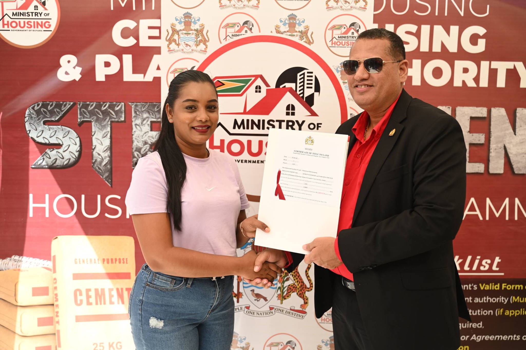 Certificates of Title issued to 85 families at Onderneeming Housing Development – INews Guyana